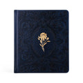 Navy faux-leather prayer journal with a debossed floral frame and a single gold flower