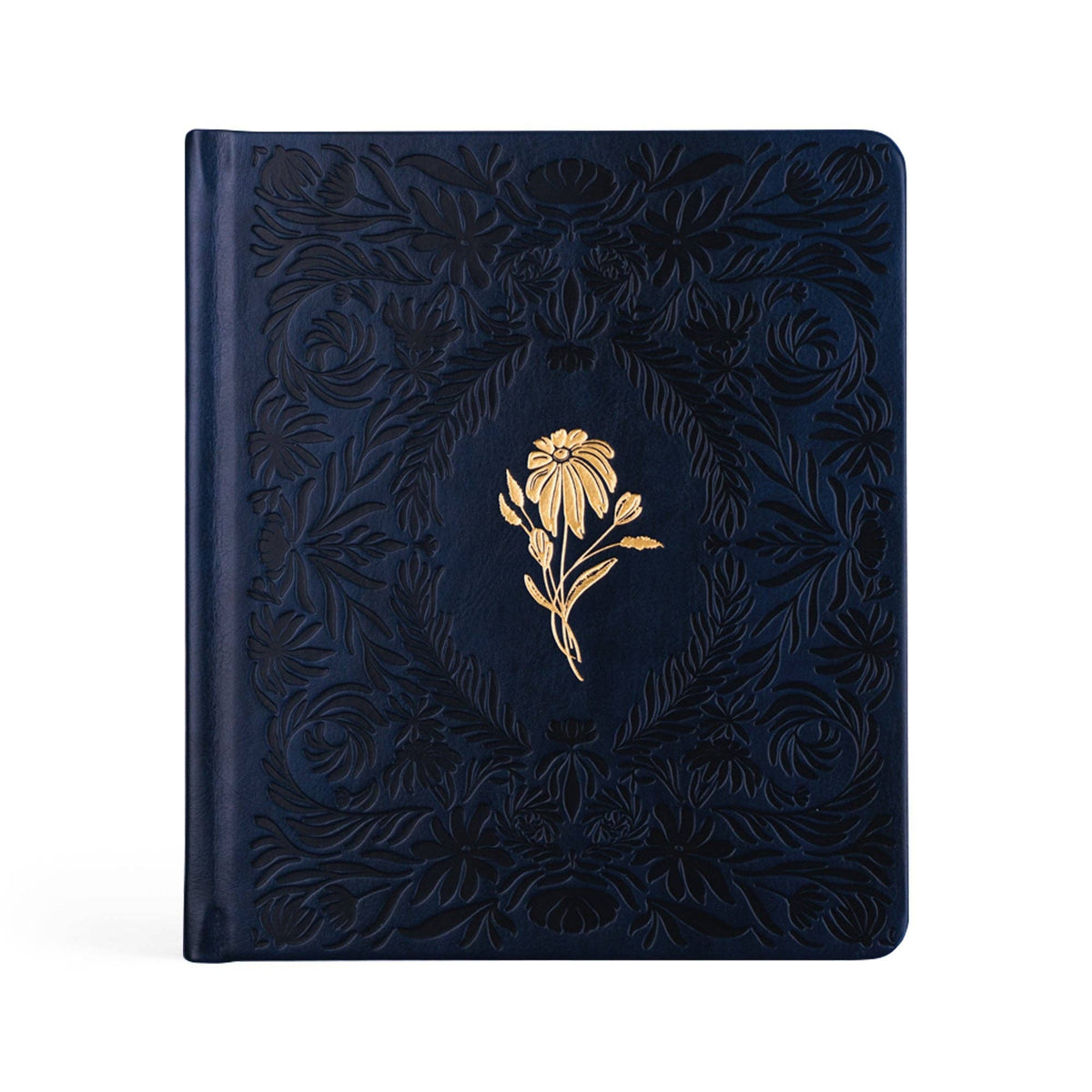 Navy faux-leather prayer journal with a debossed floral frame and a single gold flower