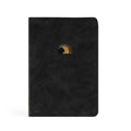 Black faux-suede notebook with a small gold sun rising behind a rolled-away stone