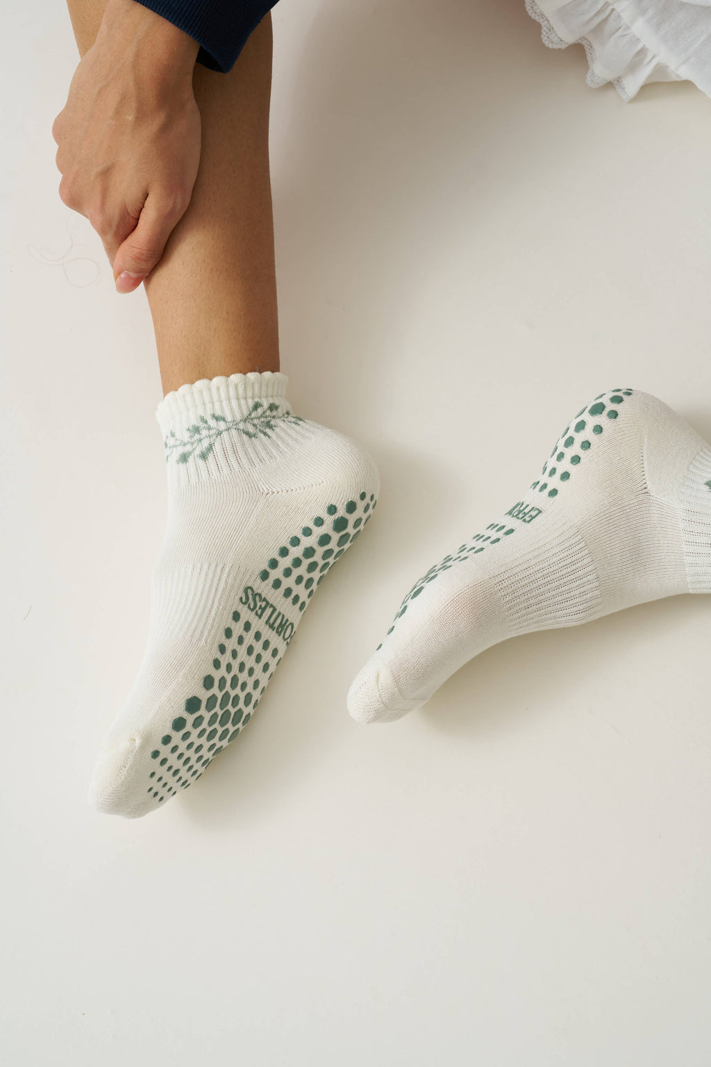 The garland grip socks worn, showing the green grip dots