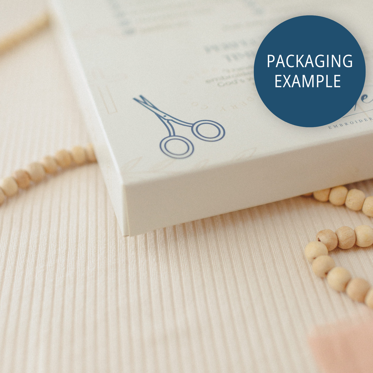 Packaging example: side of the kit box with a scissors illustration