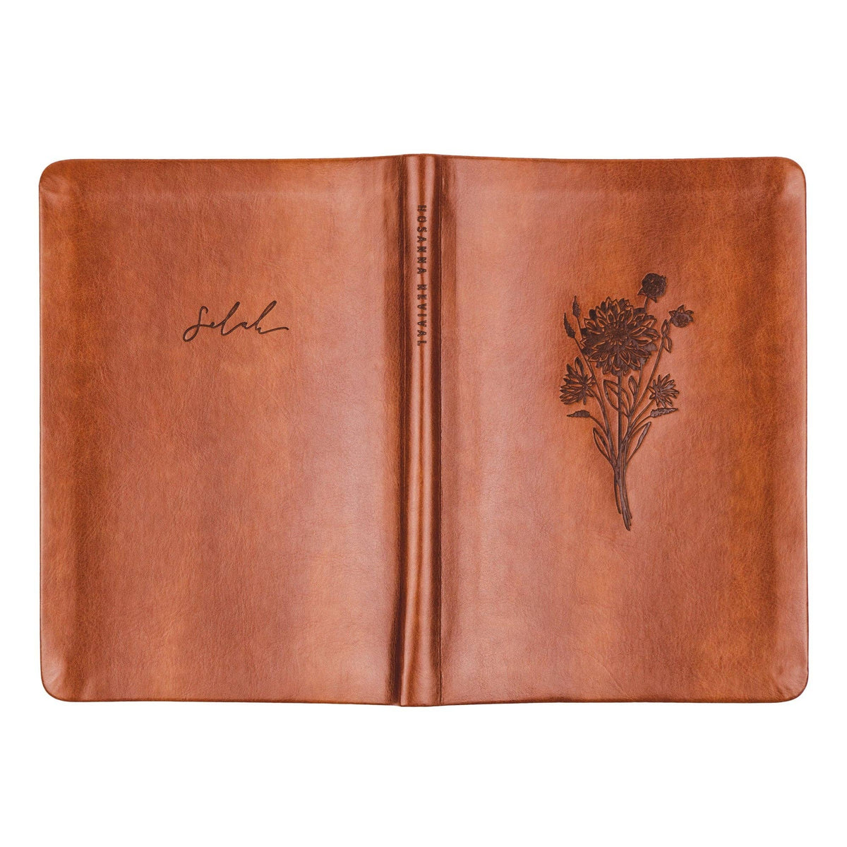 The cognac notebook opened flat, showing back and front covers