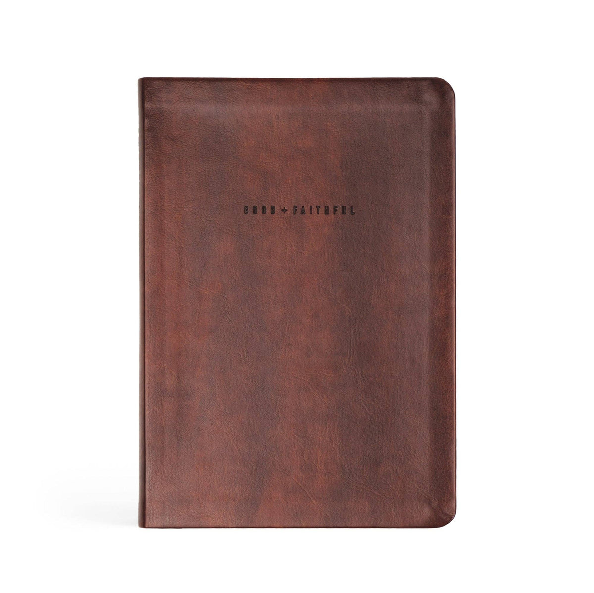 Deep brown faux-leather notebook debossed "Good + Faithful"