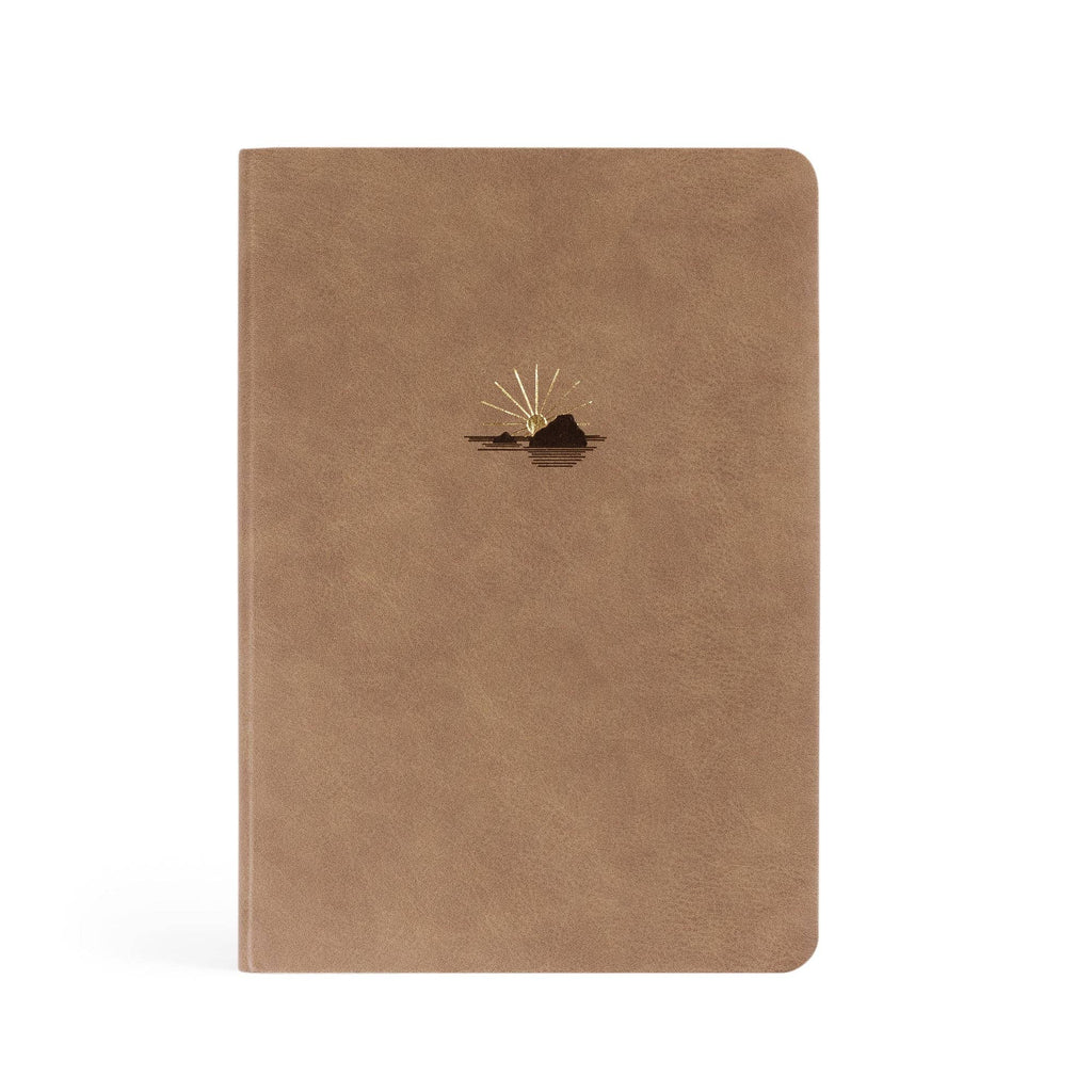 Taupe faux-leather notebook with a small gold sun rising over a rock