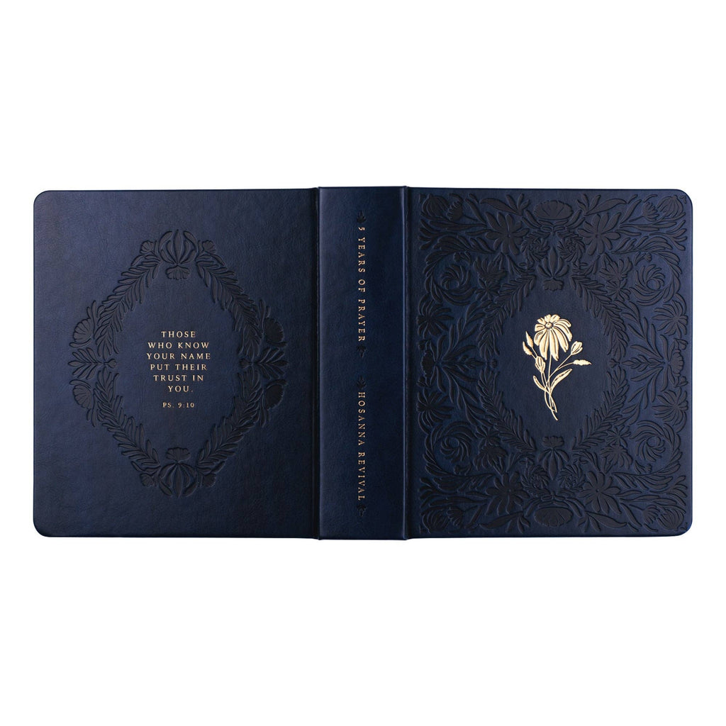 The navy journal opened flat, showing back and front covers