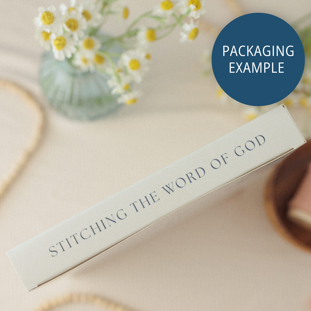 Packaging example: box edge reading "Stitching the Word of God"