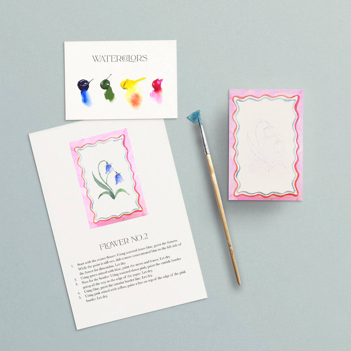 Instruction sheet for Flower No. 2, a bluebell framed by a pink wavy border, with a brush