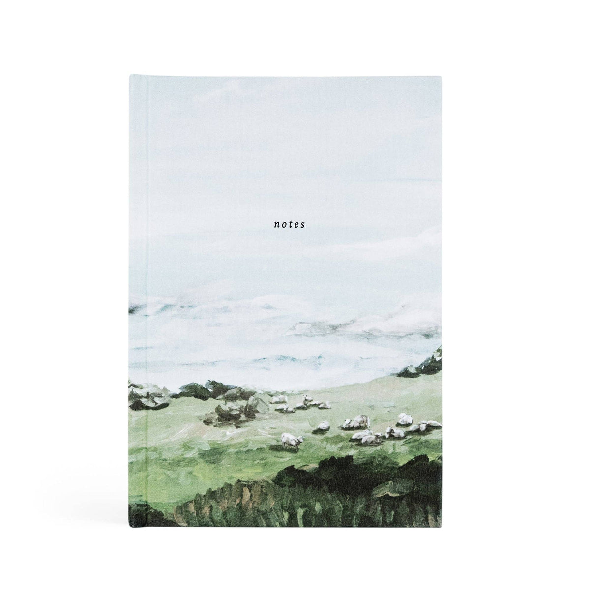 Hardcover notebook painted with green hills, grazing sheep and low clouds, titled "notes"