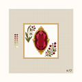 Heirloom Garnet hand-painted needlepoint canvas: a deep red faceted garnet placed between flowers