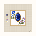 Heirloom Sapphire hand-painted needlepoint canvas: a deep blue faceted sapphire placed between flowers