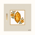 Heirloom Topaz hand-painted needlepoint canvas: a bright golden faceted topaz placed between flowers