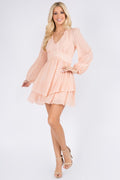 Peach swiss-dot mini dress with a V-neck, long balloon sleeves and a tiered skirt