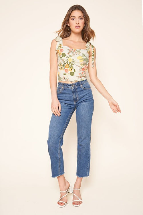 Cream floral cropped top with tie shoulder straps, worn with cropped jeans