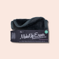 Black plush makeup removing cloth, rolled, beside its box