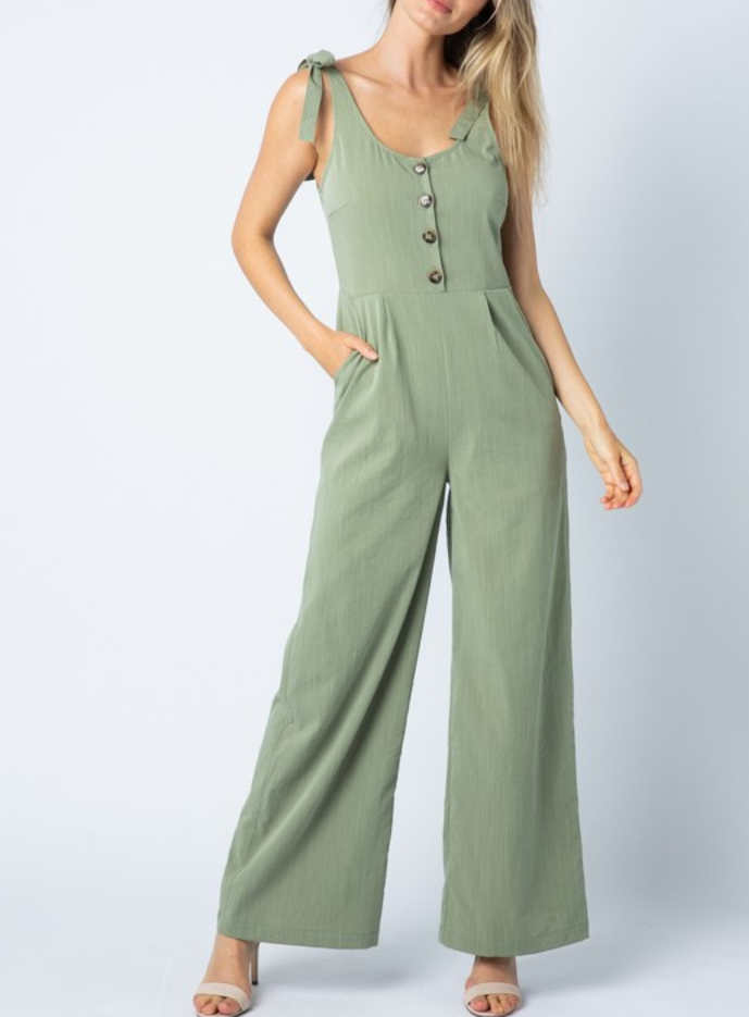 Sage green sleeveless wide-leg jumpsuit with tie shoulders and a button front