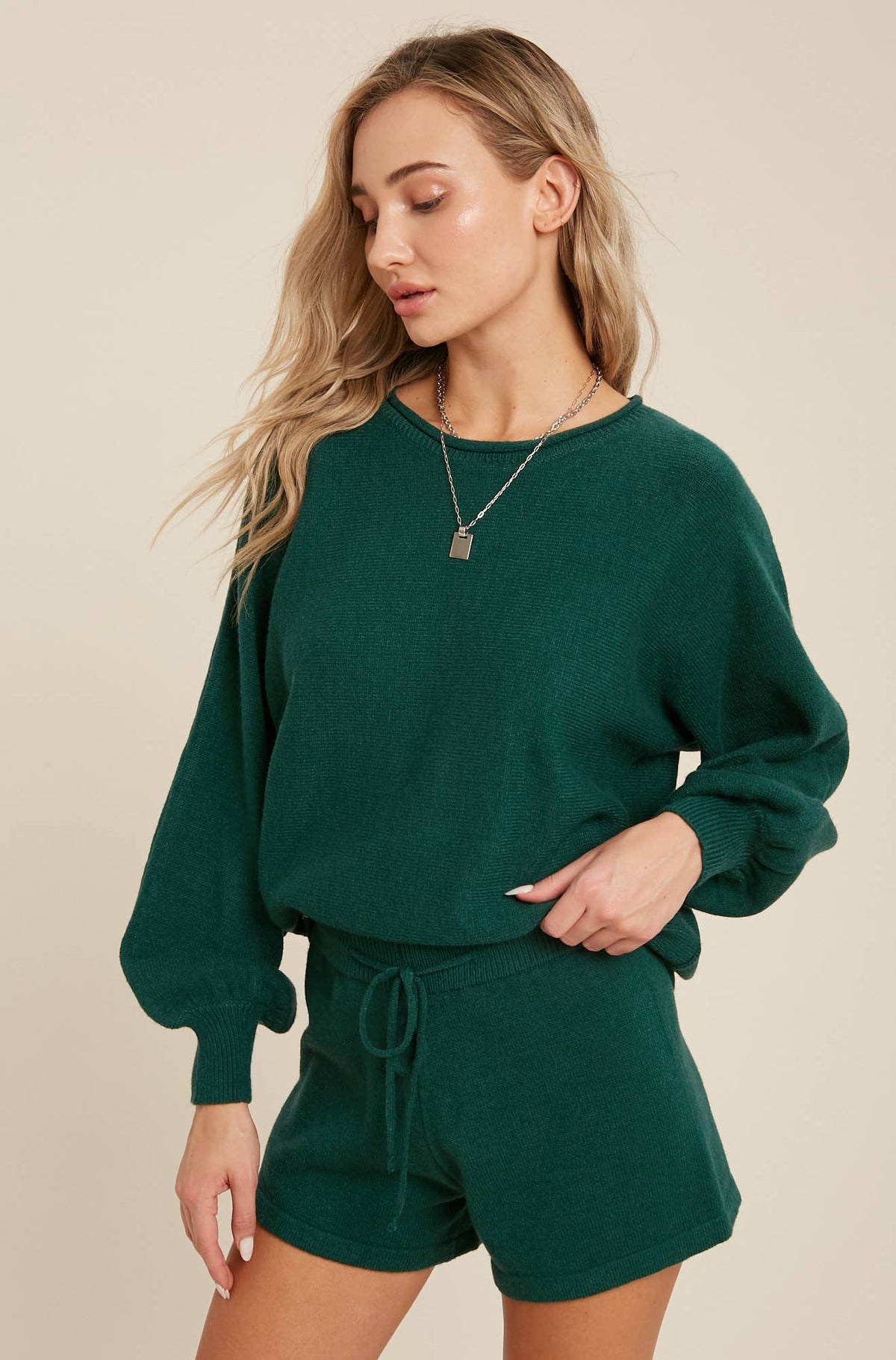 Forest green knit lounge set: a crewneck top with balloon sleeves and drawstring shorts