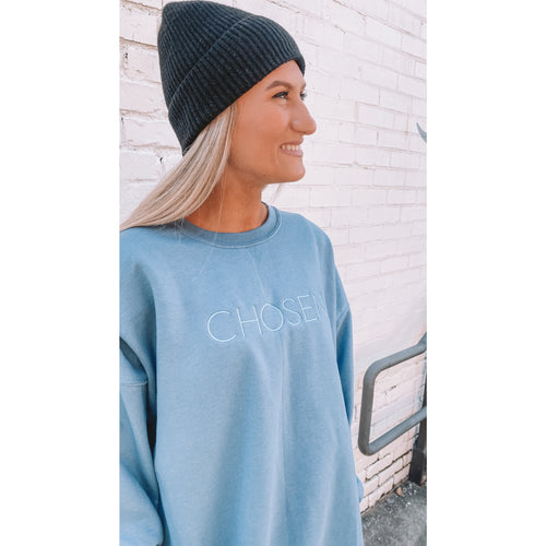 Side view of the dusty blue "CHOSEN" sweatshirt