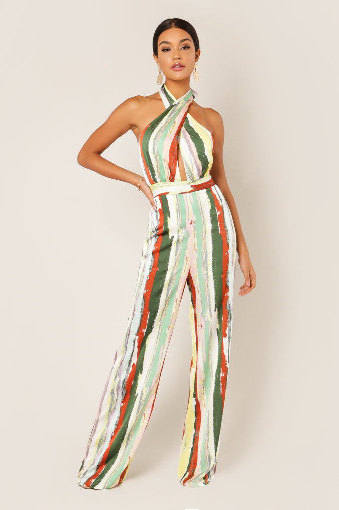 Halter jumpsuit in green, rust and cream painterly stripes with wide legs and a tie waist