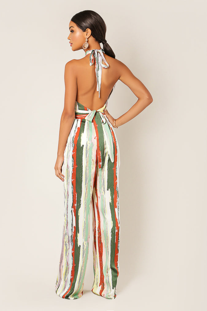 Back view of the striped jumpsuit showing the open back and neck tie