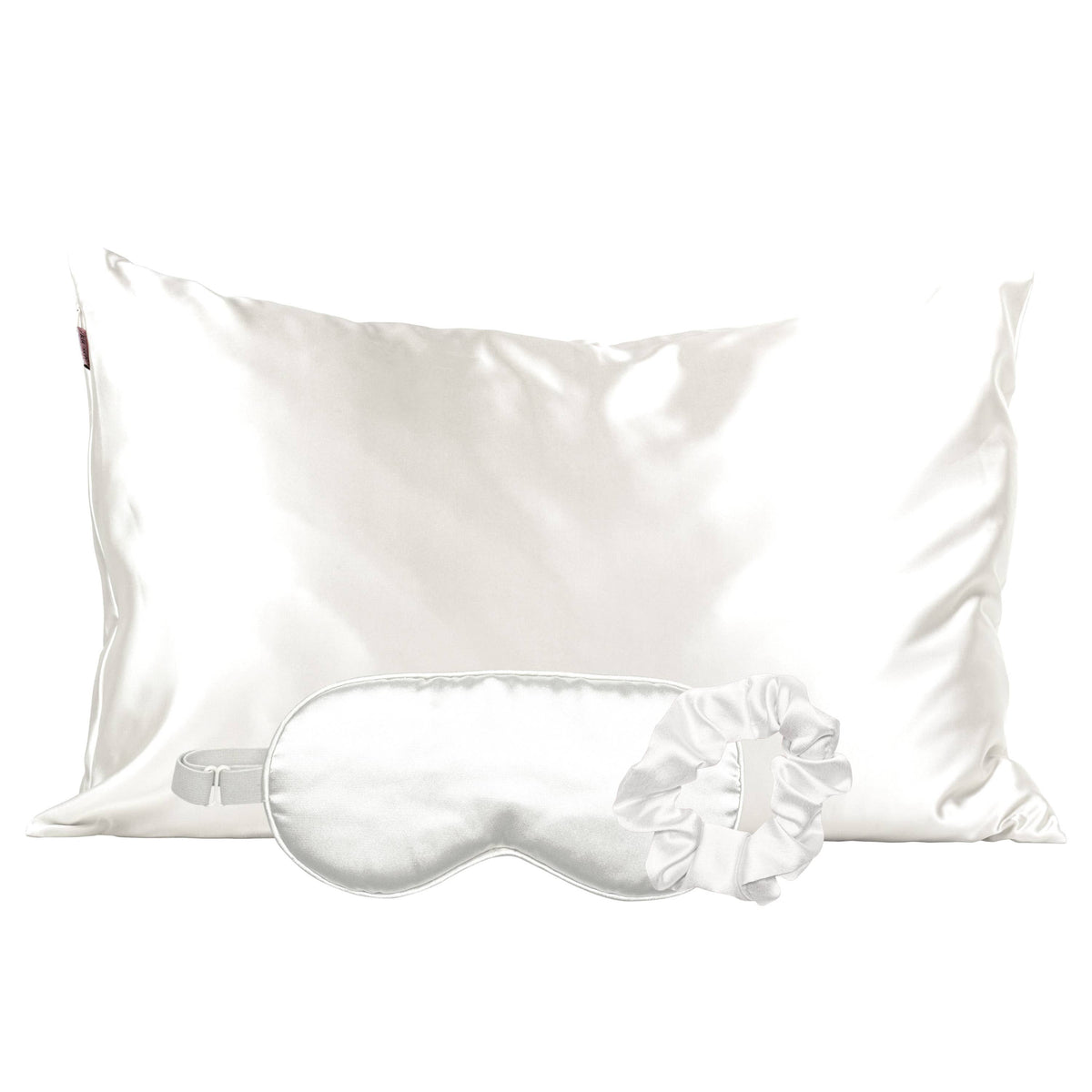 Ivory satin pillowcase with a matching sleep mask and scrunchie