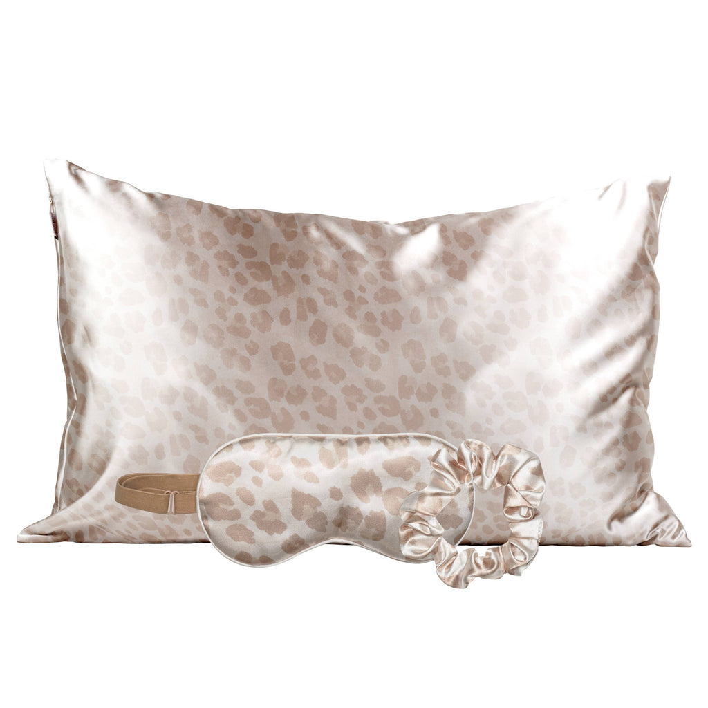 Leopard-print satin pillowcase in cream and tan with a matching sleep mask and scrunchie