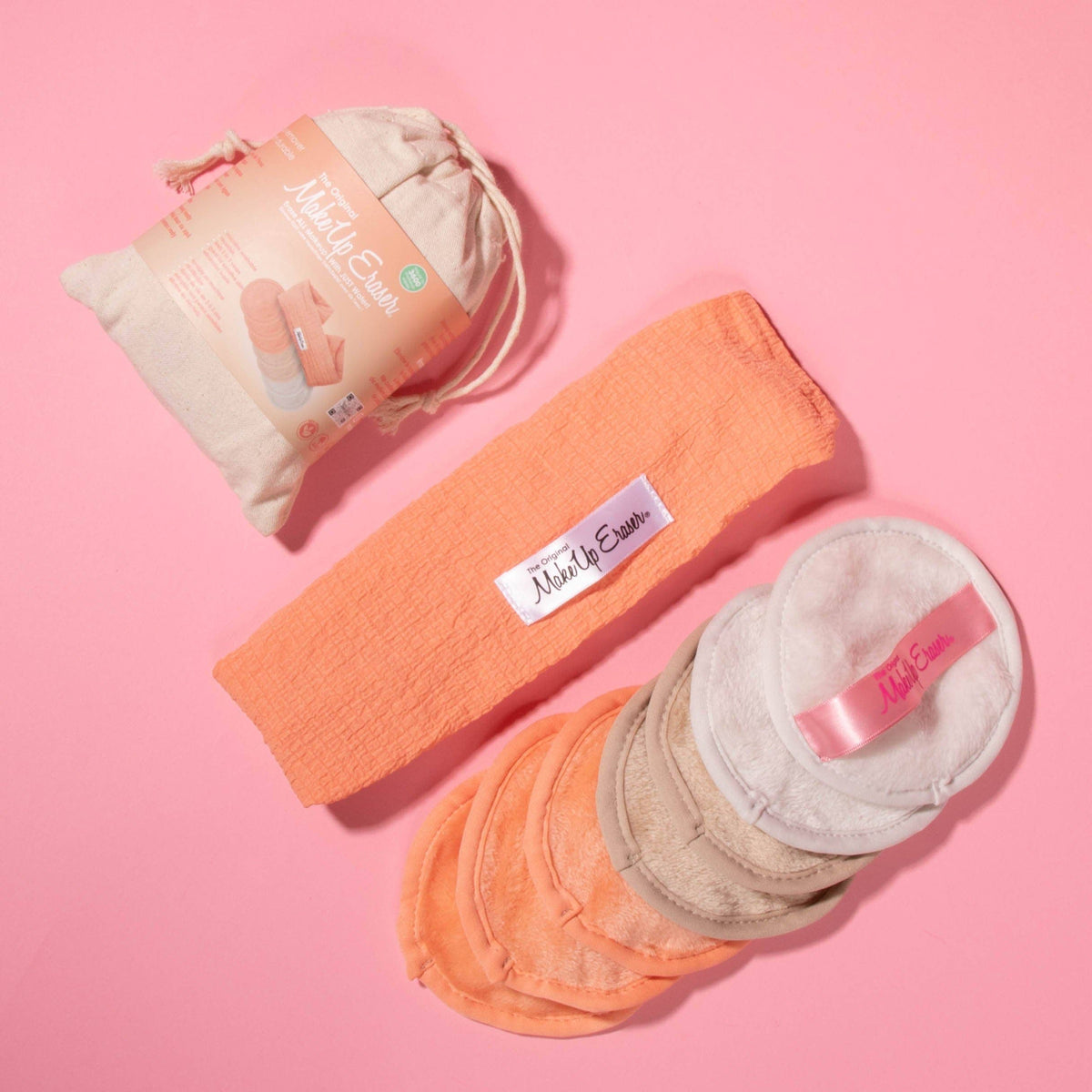 Peach and cream round makeup removing pads with a peach headband and drawstring bag