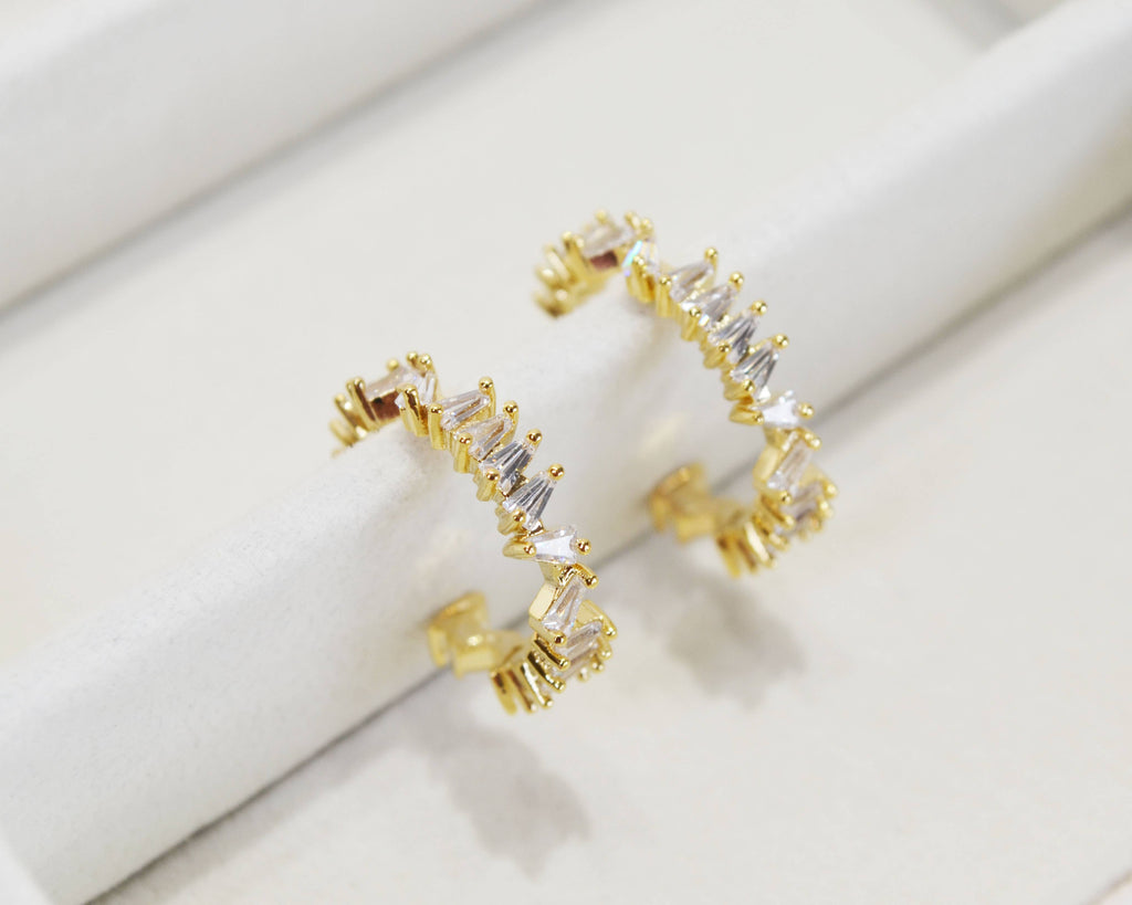 Gold open hoop earrings set with clear baguette crystals