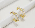 Gold open hoop earrings set with clear baguette crystals