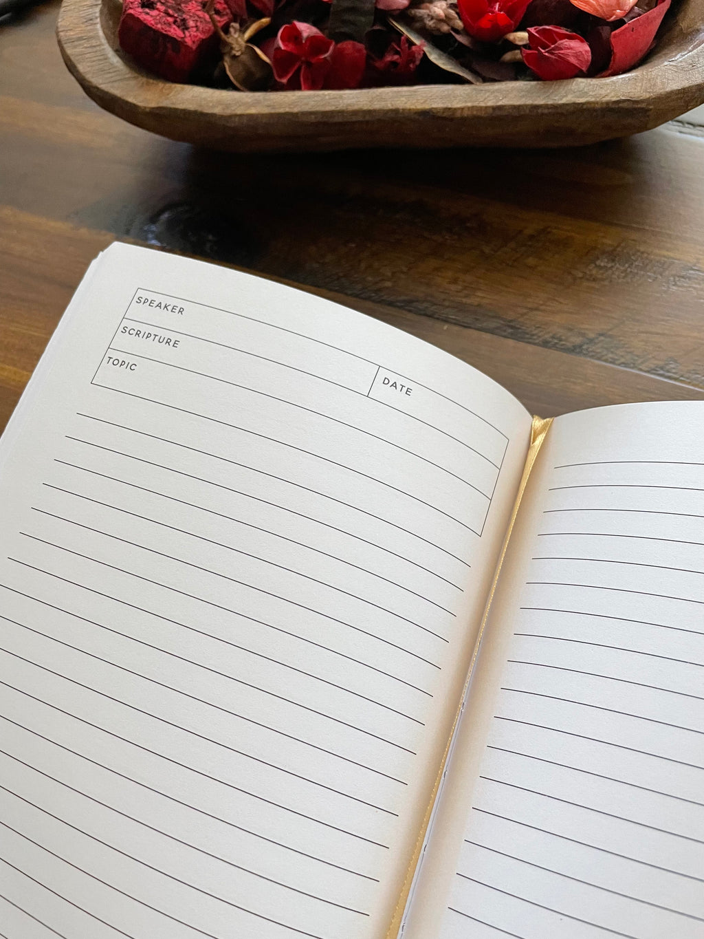 Open sermon notes journal: lined pages headed Speaker, Scripture, Topic and Date